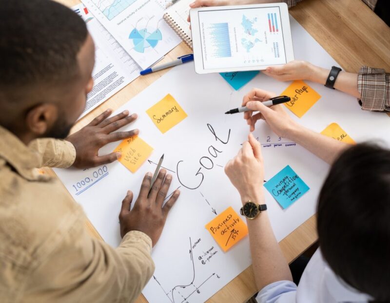 hands-of-analysts-or-brokers-discussing-financial-data-and-making-goals-table hands-of-analysts-or-brokers-discussing-financial-data-and-making-goals-table